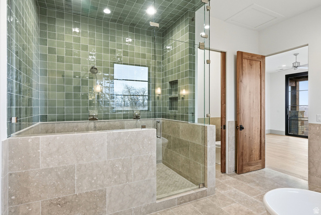 2155 East Wrangler Road Kamas, UT 84036 - Photo 48 of 62 Full bathroom featuring a stall shower, tile patterned flooring, a freestanding tub, tile walls, and recessed lighting