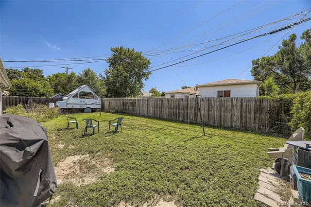 a view of a backyard with a sitting area