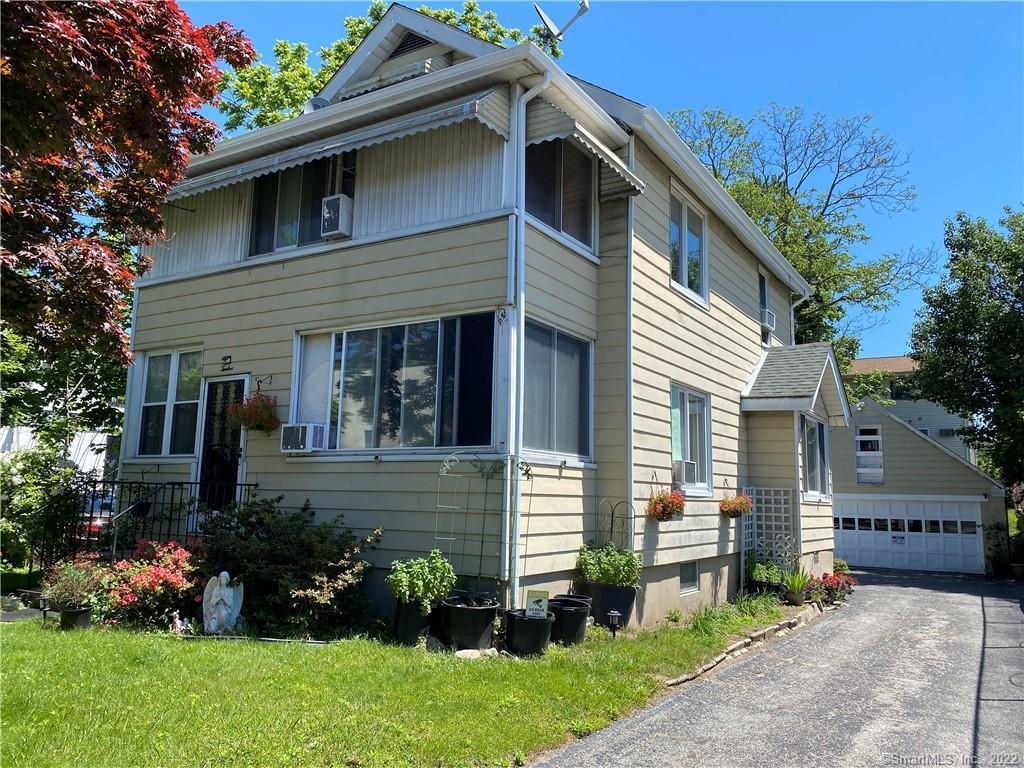 12 George Street Stamford, CT 06902 - Photo 1 of 1 a front view of a house with a garden