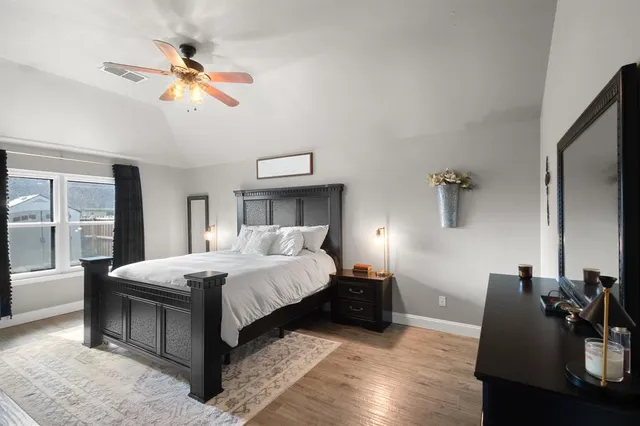 a bedroom with a bed and window