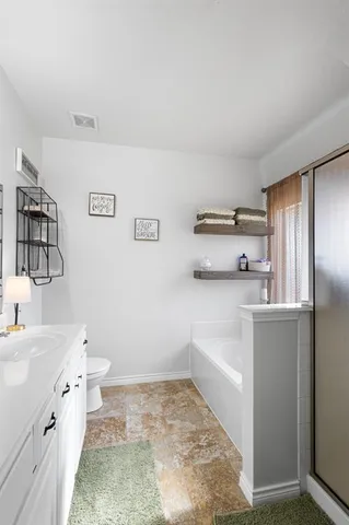 a bathroom with a bathtub and shower