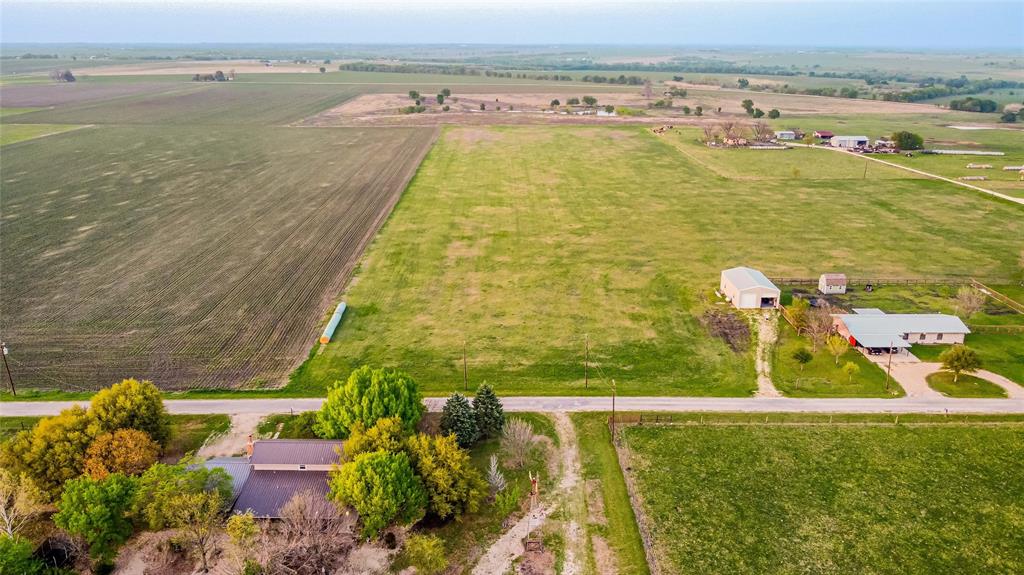 Aerial view of property's location featuring rural landscape and a pastoral area