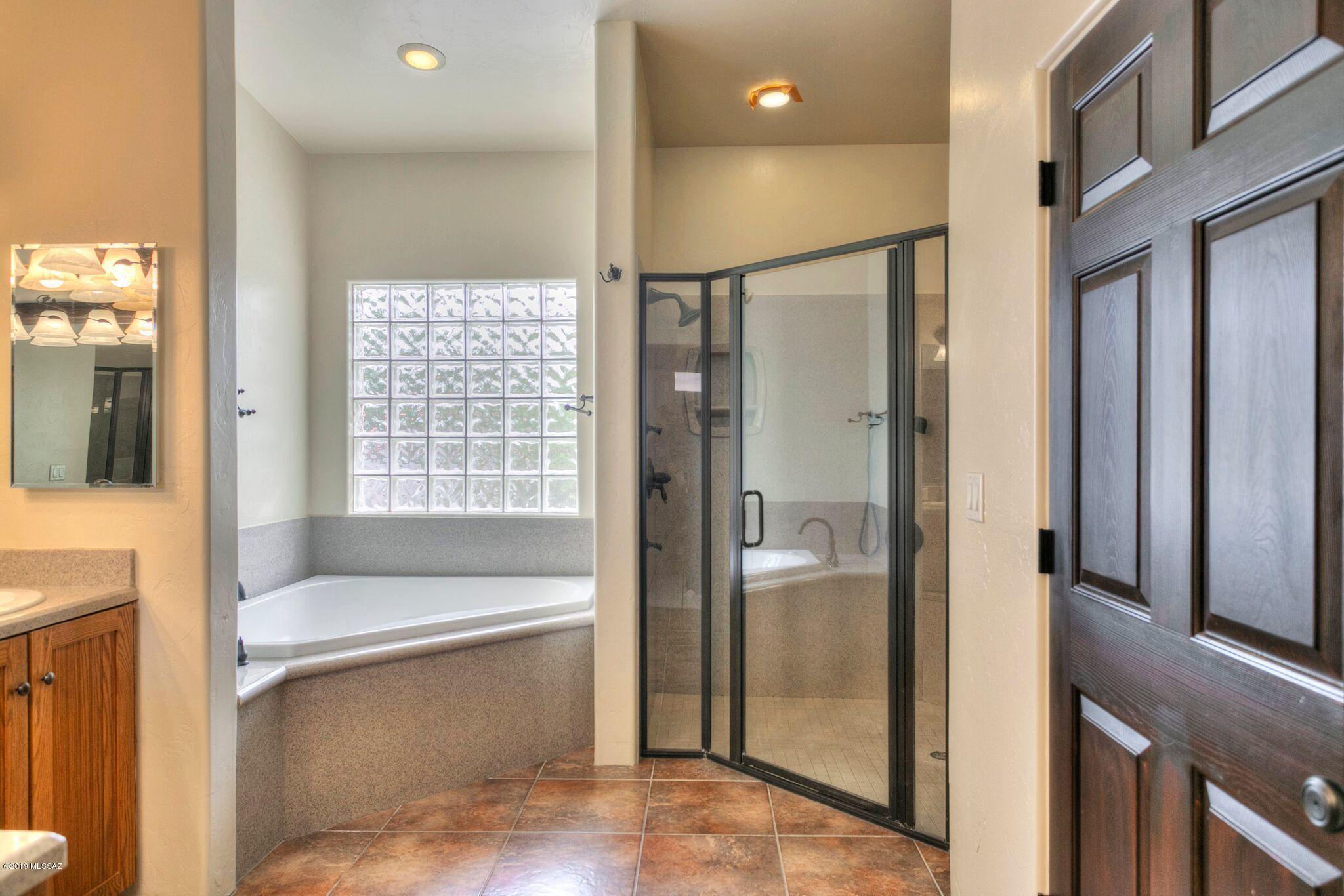 1648 Circulo Puerto Rio Rico, AZ 85648 - Photo 19 of 34 a bathroom with a tub and shower