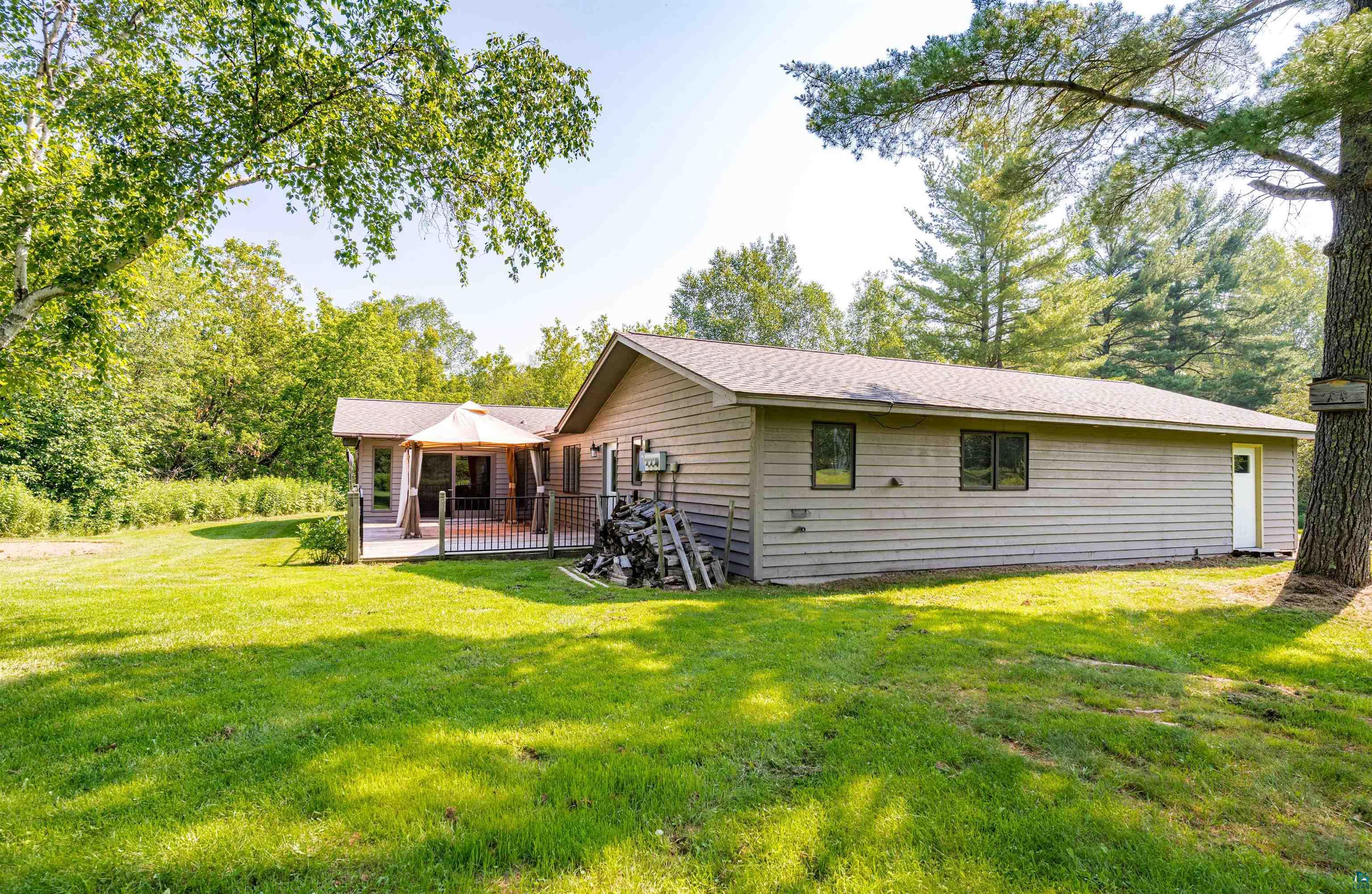 3837 Kansy Road Superior, WI 54880 - Photo 44 of 50 Rear view of property featuring a yard