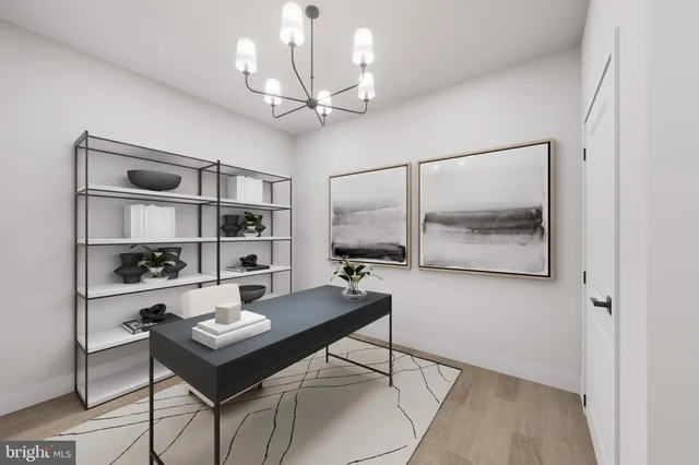 a workspace with wooden floor and a bookshelf