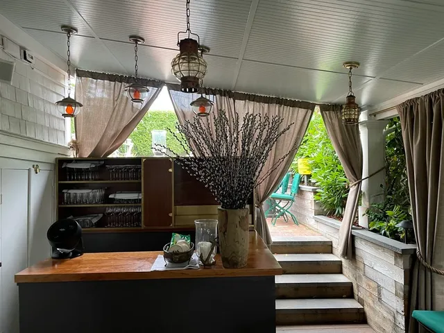 a room with patio outer view and wooden floor