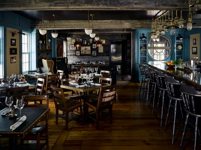 a view of a dining room with lots of wooden furniture