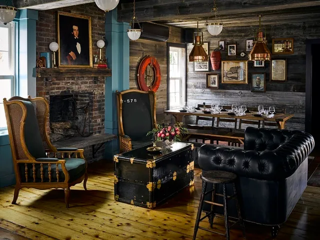 a living room filled with furniture and a fireplace