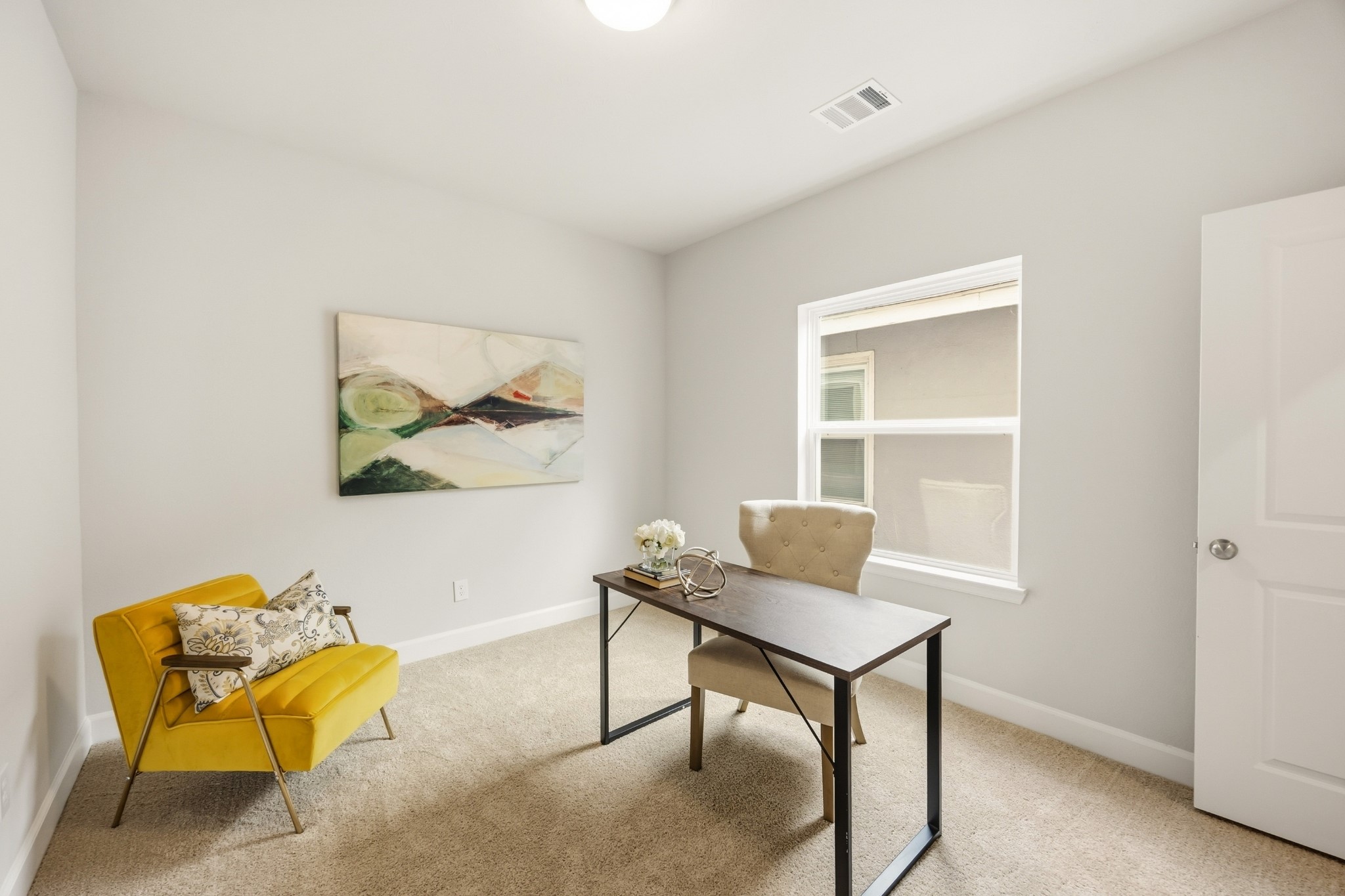 4317 Roseland Street, Unit B Houston, TX 77006 - Photo 22 of 29 A secondary bedroom on the second floor presents a perfect blend of comfort and functionality, complete with window and proximity to the shared hall bathroom.