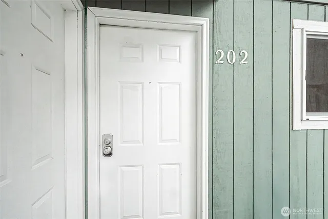 a view of an empty room with a fireplace