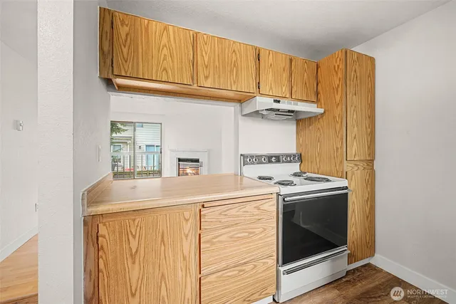 a view of hallway with wooden floor