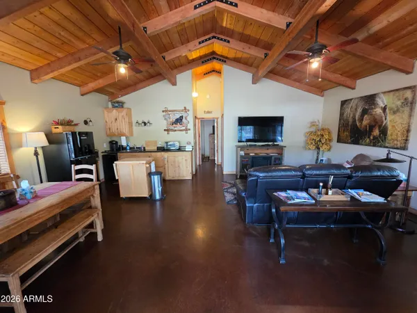 a living room with furniture and a mirror