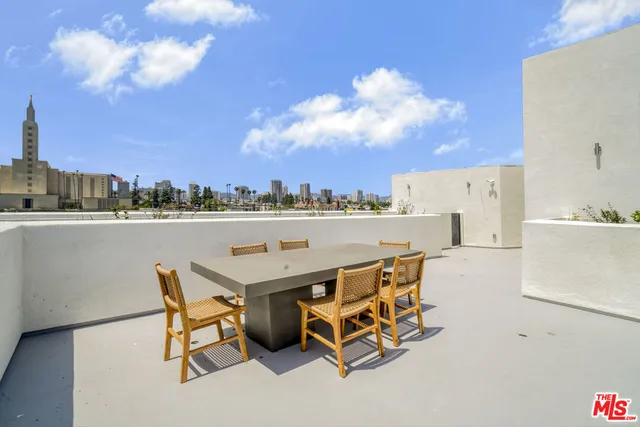 a terrace with a table and chairs