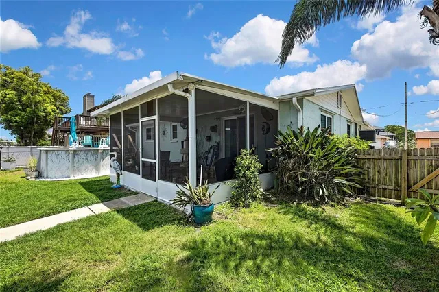a front view of a house with a garden and yard
