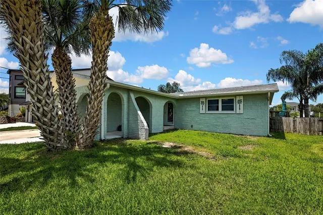 an aerial view of houses with yard