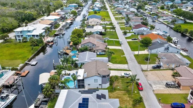 an aerial view of residential houses with outdoor space