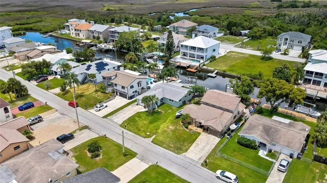 an aerial view of a house with a swimming pool yard and outdoor seating