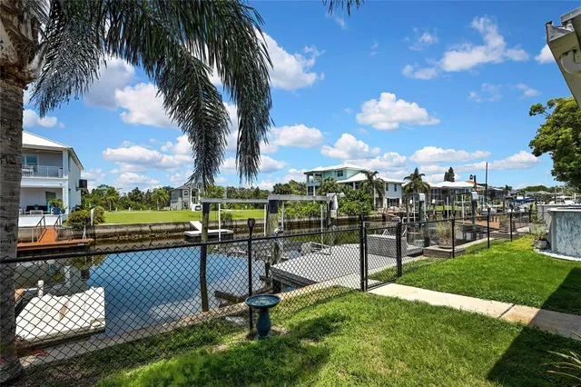 a view of a swimming pool with a patio and a garden