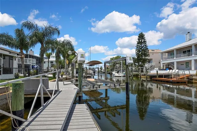 a view of a chairs and table in the balcony