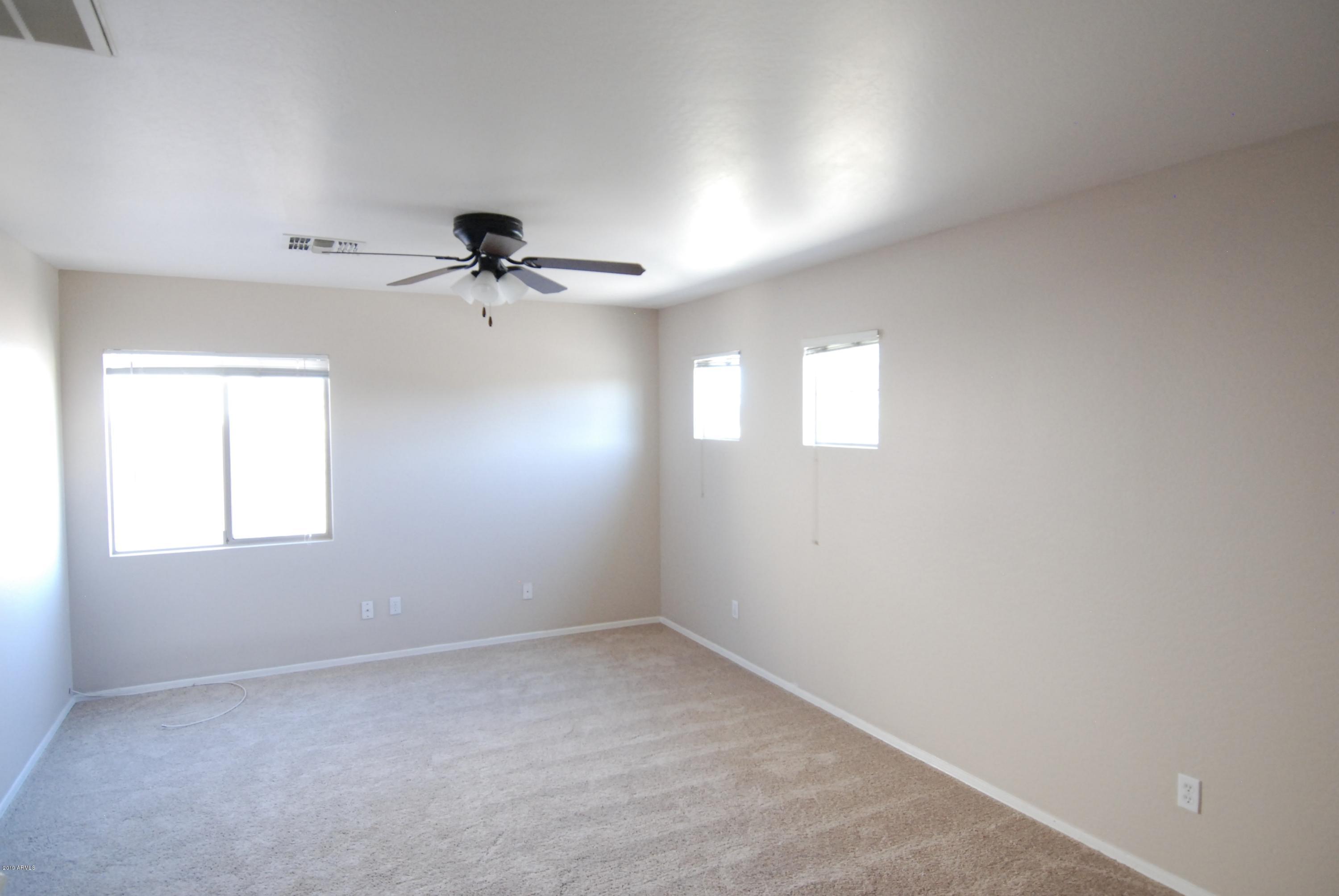 5219 West Maldonado Road Laveen, AZ 85339 - Photo 8 of 19 Master bedroom