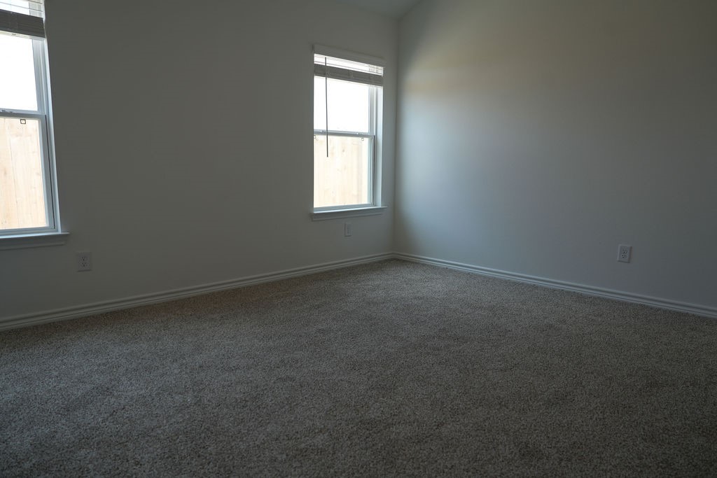 10465 Sugar Mill Drive Conroe, TX 77306 - Photo 11 of 29 an empty room with a window