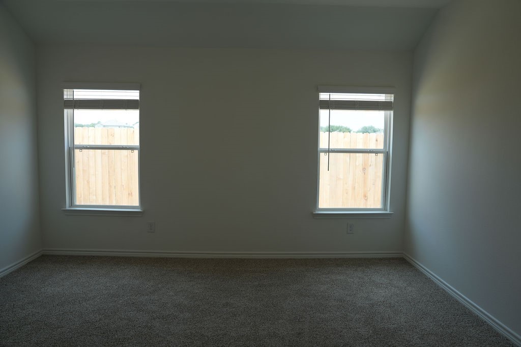 10465 Sugar Mill Drive Conroe, TX 77306 - Photo 13 of 29 an empty room with a window