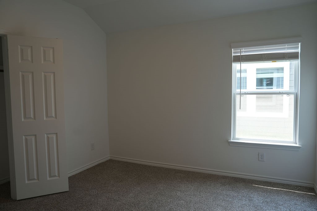 10465 Sugar Mill Drive Conroe, TX 77306 - Photo 15 of 29 an empty room with a window
