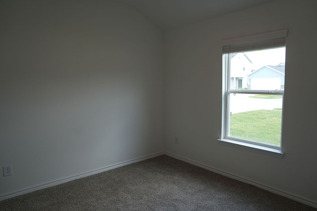 10465 Sugar Mill Drive Conroe, TX 77306 - Photo 24 of 29 an empty room with a window