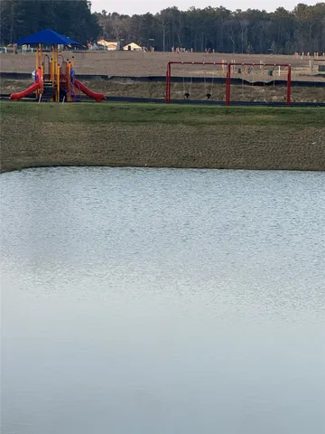 a view of a lake with a big yard