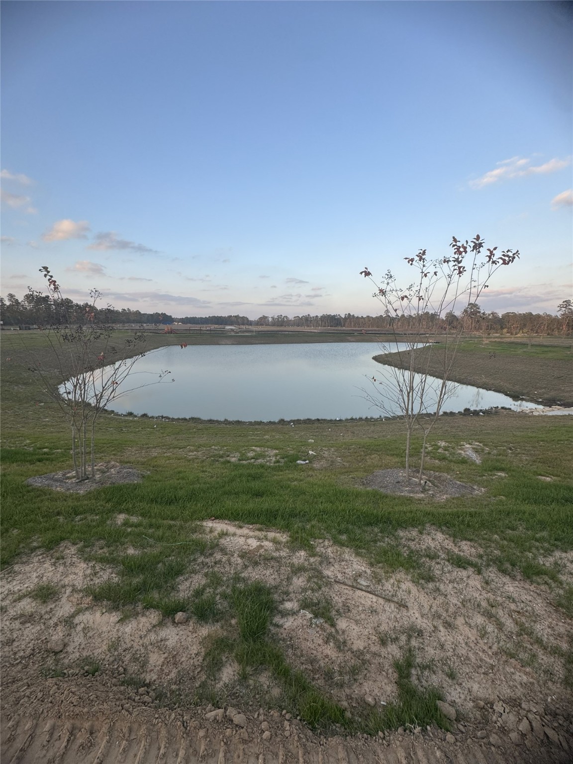 10465 Sugar Mill Drive Conroe, TX 77306 - Photo 29 of 29 a view of a lake with a big yard