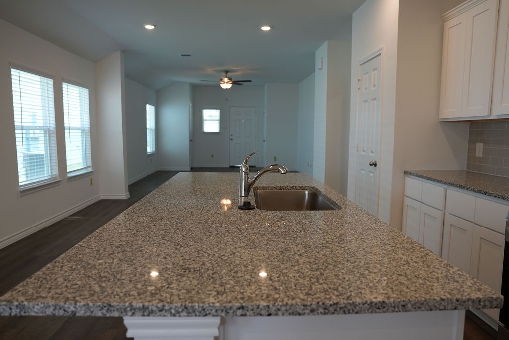 10465 Sugar Mill Drive Conroe, TX 77306 - Photo 7 of 29 a kitchen with sink and window