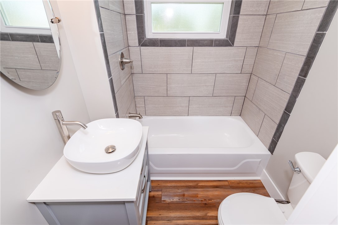1217 Jasper Road Xenia, OH 45385 - Photo 45 of 62 This sleek bathroom features contemporary fixtures and durable LVP flooring.