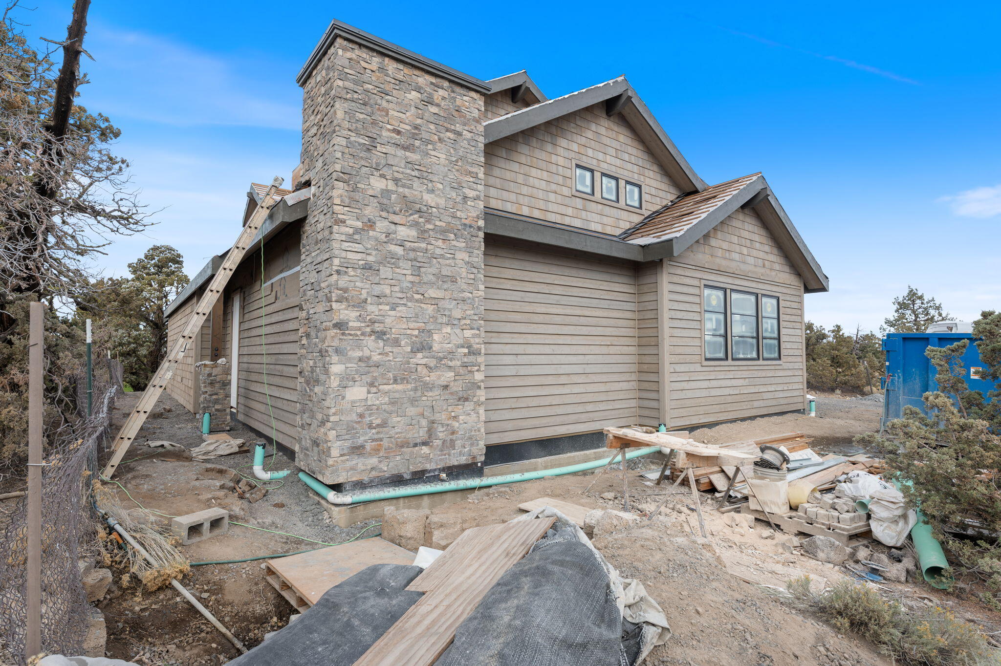 22936 Ghost Tree Lane Bend, OR 97701 - Photo 22 of 74 a front view of a house with a yard