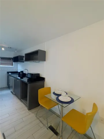a kitchen with stainless steel appliances granite countertop a sink and a stove
