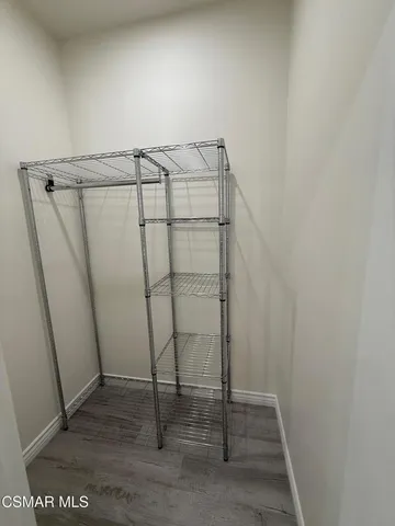 a view of a dining room with furniture and window