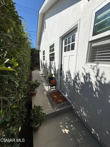 a view of a patio with a table and chairs