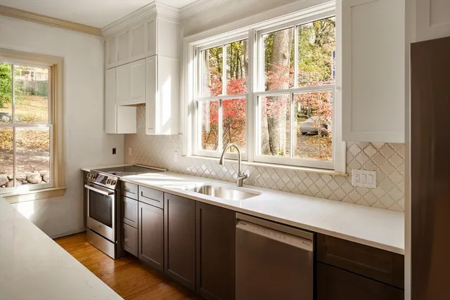 a kitchen with a sink and a window