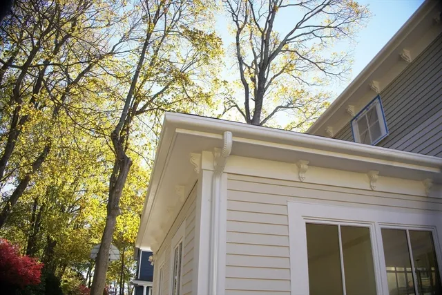 a view of a house with a tree