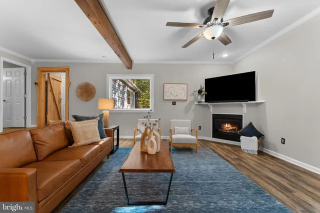 a big room with wooden floor and entryway