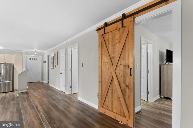 a room with gym equipment and windows