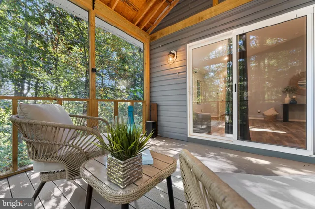 a view of backyard with plants and outdoor seating
