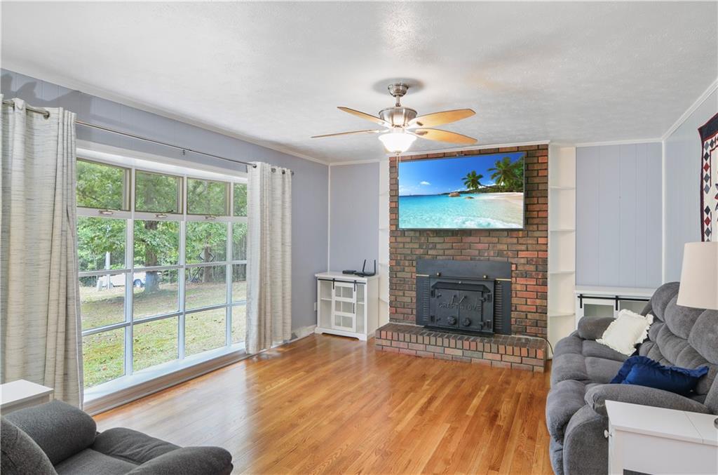 3243 Highway 184 Toccoa, GA 30577 - Photo 15 of 33 a living room with furniture and a fireplace
