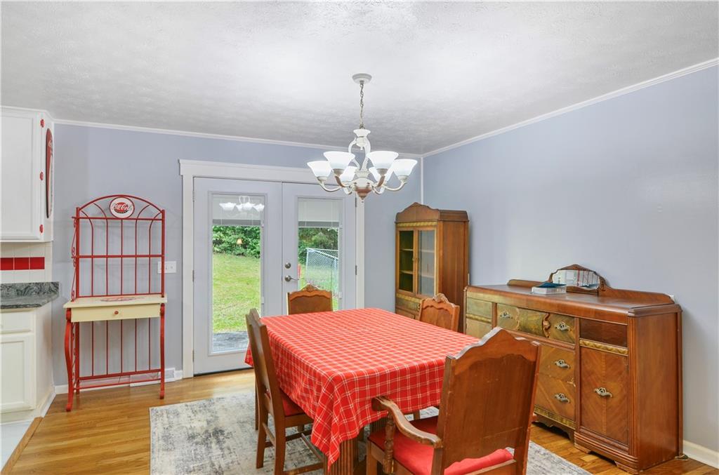 3243 Highway 184 Toccoa, GA 30577 - Photo 17 of 33 a dining room with furniture a chandelier and window