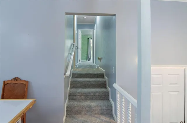 a bedroom with a bed dresser and a window