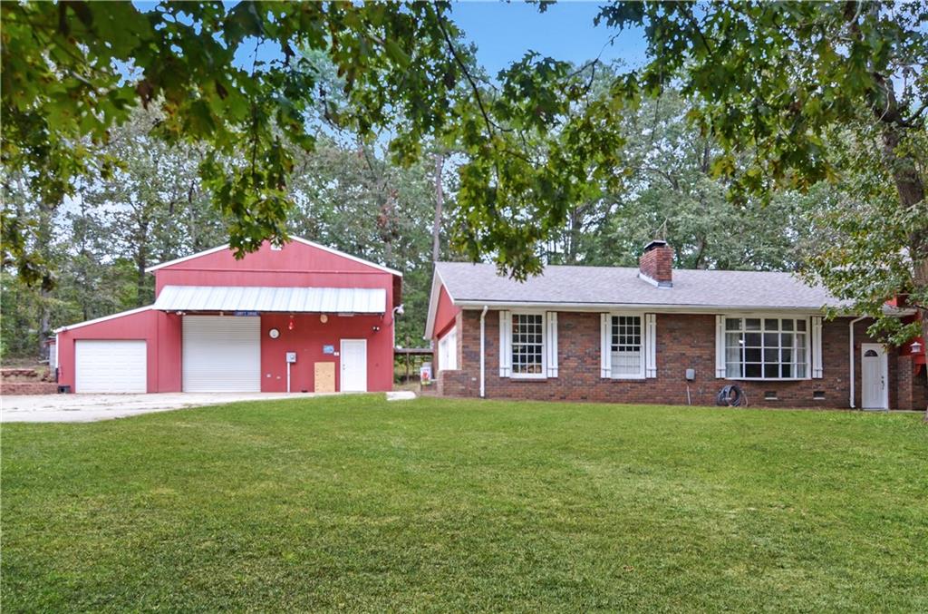 3243 Highway 184 Toccoa, GA 30577 - Photo 3 of 33 a front view of a house with a garden