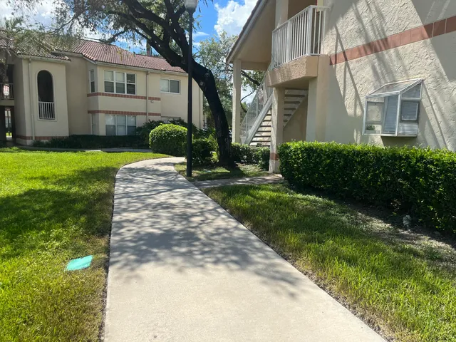 a view of a yard in front of a house