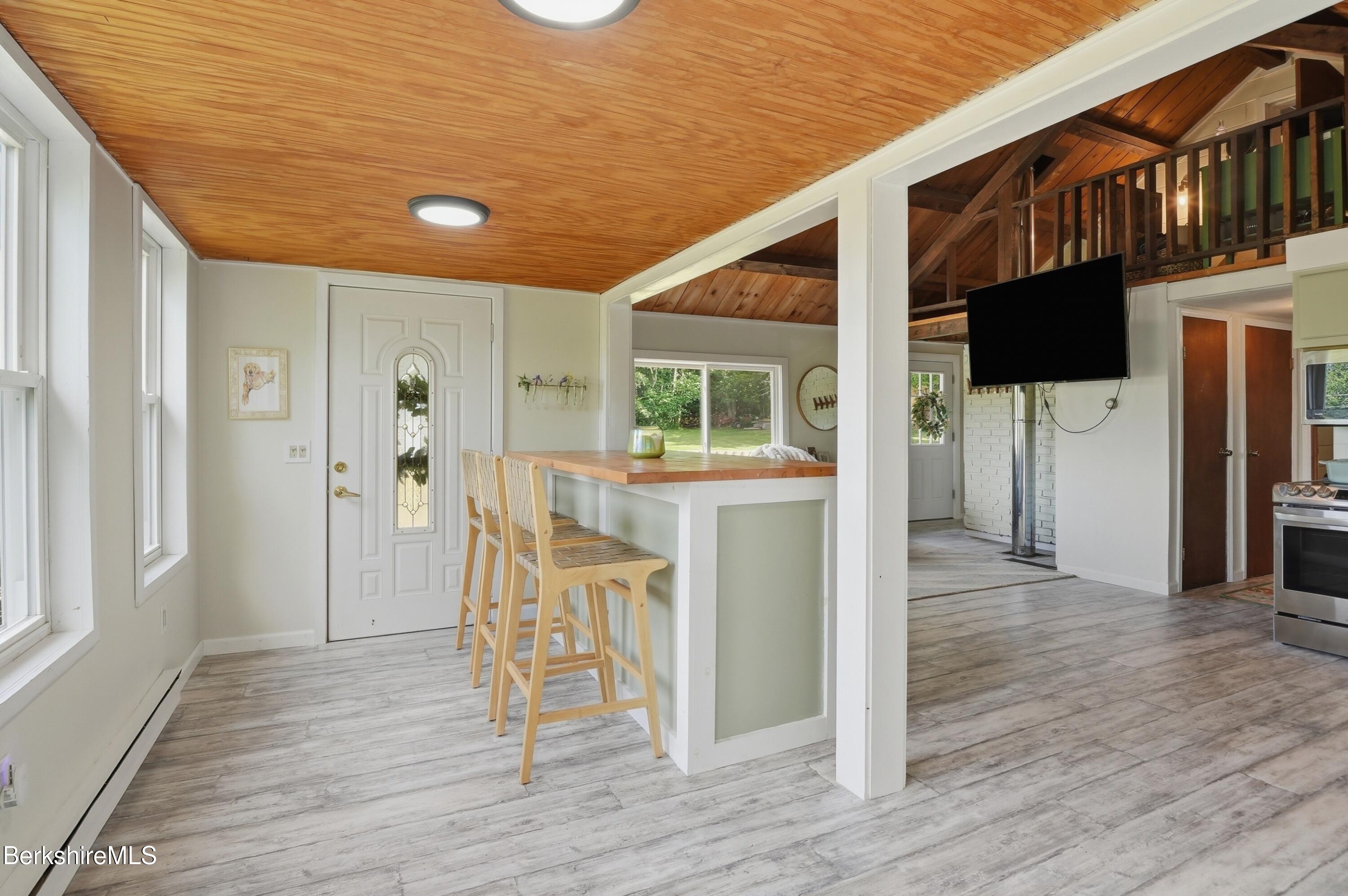 4 David Drive Peru, MA 01235 - Photo 12 of 44 a view of a hallway with wooden floor windows and a kitchen