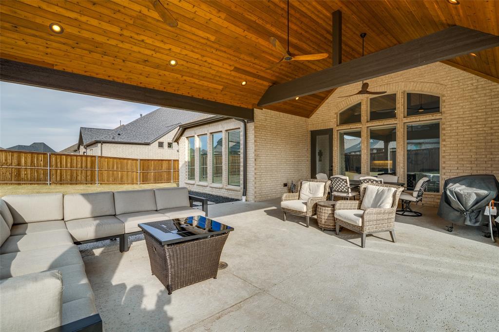 1614 Ripasso Way McLendon-Chisholm, TX 75032 - Photo 3 of 36 Hang a TV and you're ready for Super Bowl, Stars games and even movie night!!! This is one of the largest and nicest covered patios and the next buyer will get to take advantage of it!
