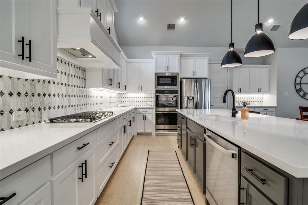 1614 Ripasso Way McLendon-Chisholm, TX 75032 - Photo 9 of 37 Beautiful backsplash, counters and clean aesthetic.