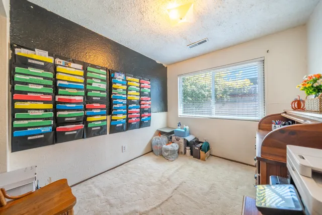 a room with toys and a flat screen tv